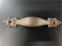 Cast iron drawer pull, fairly ornate, total length