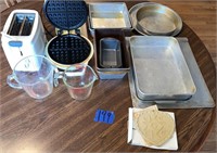 Bake pans, toaster, glass measuring cups , waffle