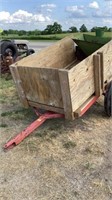 Towed wagon with end gate spreader