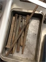 Chisels in metal pan