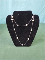 Bead and silver colored necklace