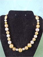 Silver and gold colored beaded necklace 12" long