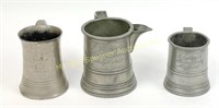 THREE VICTORIAN ENGLISH PEWTER MUGS AND MEASURE