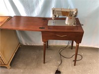 MCM SINGER CABINET SEWING MACHINE. POWERS UP AND