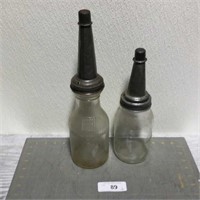 2 vintage glass oil bottles
