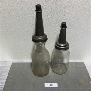 2 vintage glass oil bottles