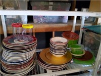 Shelf full of dishes mostly holiday