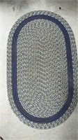 Small oval braided rug, could use a cleaning,