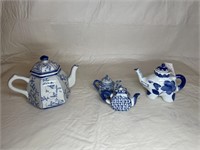 Four oriental teapots