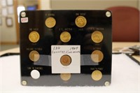 Plastic display containing 11 BU Foreign Gold Coin