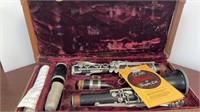 Vintage Conn clarinet with lined carrying case.