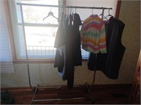 Rolling clothes rack with king sized mens clothes