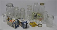 Box of various style glass jars and canisters.