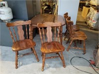 Table with 2 extra leaves and 4 chairs