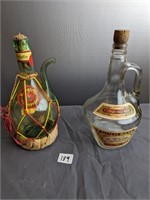 2 vintage wine bottles with wicker bottom