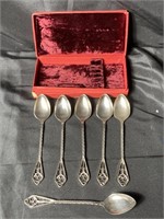Set of vintage silver tone spoons in velvet