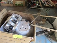 Three 1-ton Chevy hubcaps, container of zip ties,