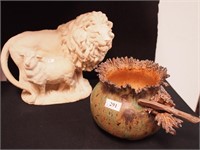 White resin figurine of a lion and sheep, 9" long