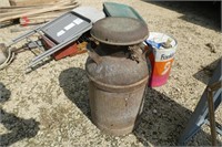 Milk can - partially full of drain oil