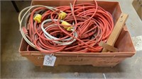 Plastic tote of 8 misc size extension cords