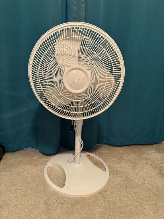 Rotating white floor fan