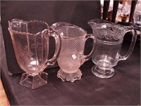 Three early American pattern glass water serving