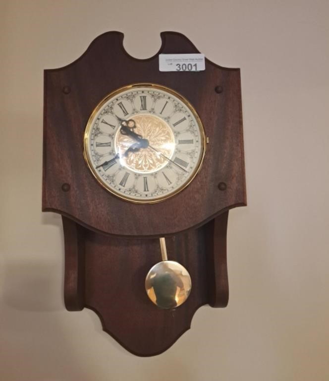 Hanging wall clock. 11" l x 6" w x 19" h