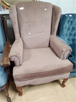 Mauve colored wingback chair