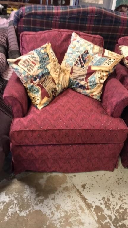 Mauve upholstery chair with pillows