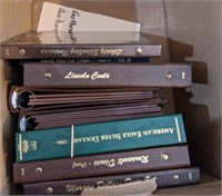 Box of empty coin books