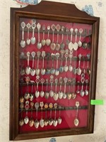 Collectible Spoons In Display Cabinet