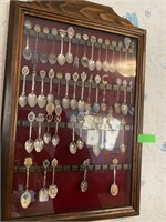 Collectible Spoons In Display Cabinet