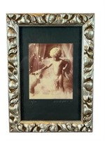 A Framed Signed Photograph #1/30 Frame: 11H x 8W