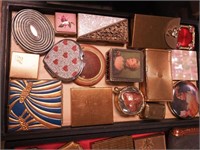 Container of vintage compacts including card