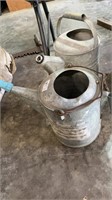 2 galvanized watering Cans