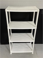 White plastic four tiered shelf