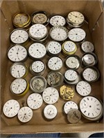 Pocket watch movements in their metal shipping