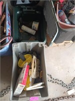 Plastic storage tote of assorted tools, gardening,