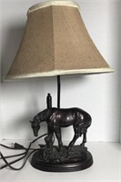 Table lamp with metal base depicting little girl