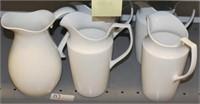 Shelf lot: 5 large white pitchers
