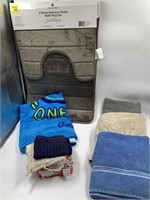 New bathmat, and assorted towels and washcloths