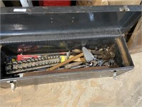 assorted tools in toolbox including wrenches and