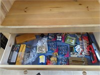 Contents of blonde cupboard drawer