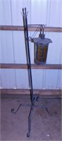 Wrought iron & amber glass patio lamp, 51" tall,