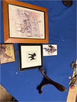 Assorted pictures and picture stand