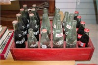 RED WOODEN CRATE WITH COCA COLA BOTTLES CONTENT