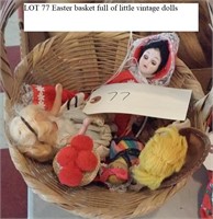 Easter basket full of small vintage dolls
