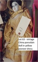 vintage porcelain victorian doll in pioneer dress