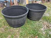 Two plastic barrel planters