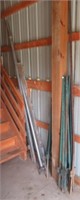 Lot that includes (13) fence posts, bamboo poles,
